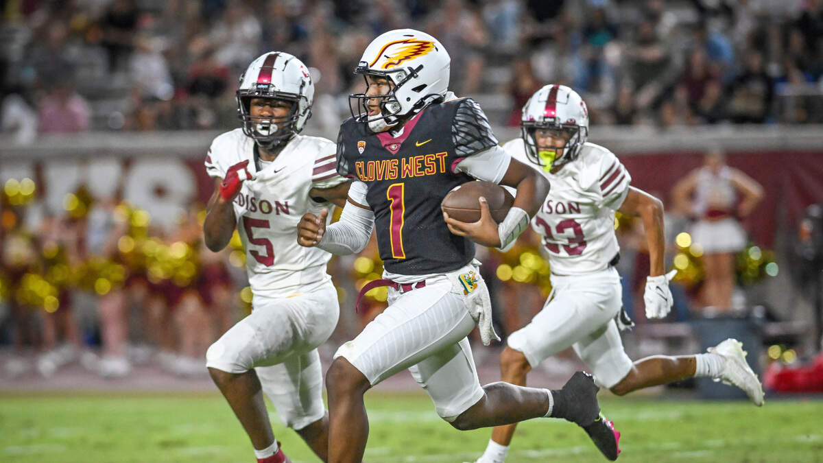 Clovis West quarterback Jamar (JJ) Howard, center, takes the ball across the field on a keeper against Edison in the first half of their game at Veterans Memorial Stadium in Clovis on Friday, Sept. 5, 2025. Clovis West quarterback Jamar (JJ) Howard, center, takes the ball across the field on a keeper against Edison in the first half of their game at Veterans Memorial Stadium in Clovis on Friday, Sept. 5, 2025.